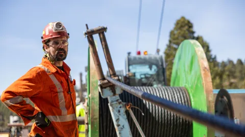 Ross Shaft Crews work alongside technicians at Fortis Mining Engineering & Manufacturing Company on the rope change.   Here the old rope is spooled off the Headframe and onto a new spool. 