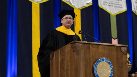 Mike headley speaking at the 2026 SDSU graduation