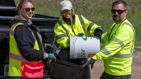 Volunteers in Kirk Canyon remove trash during the 2026 clean-up day at SURF. 